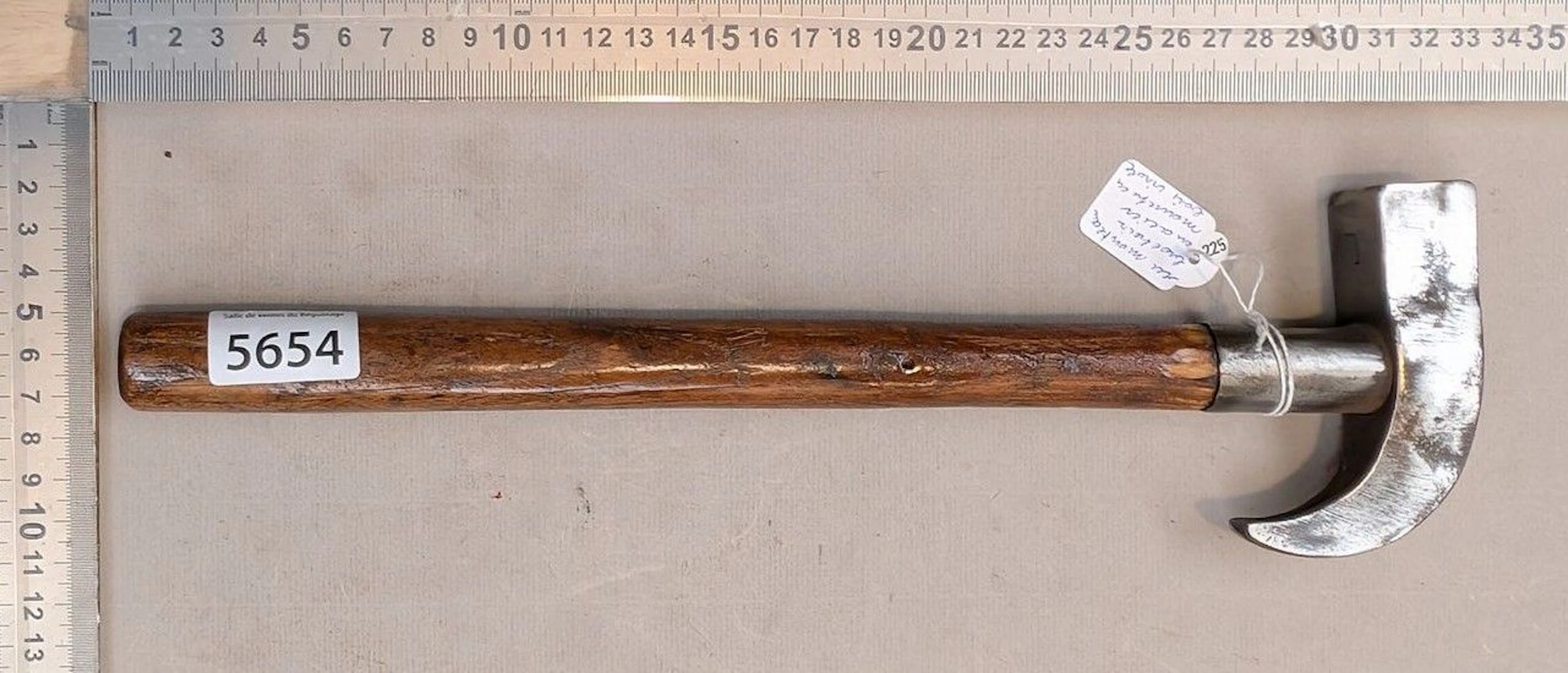 A rivet hammer with a wooden handle and steel ferrule—see photos for