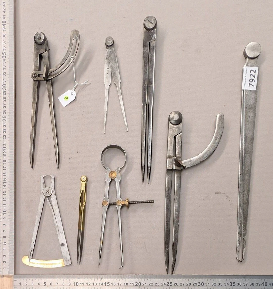 1 set of 8 different compasses—see photos for dimensions and condition