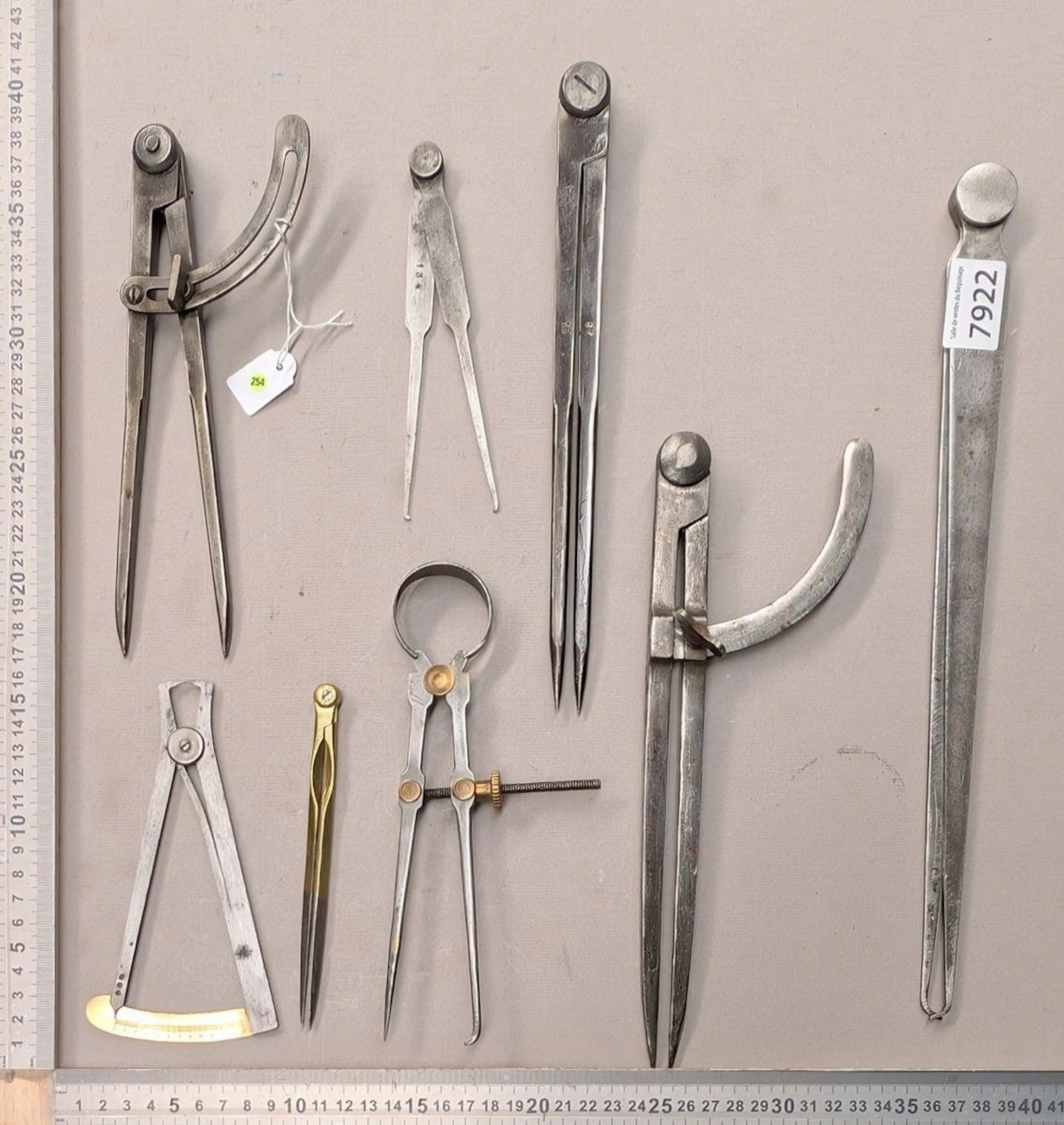 1 set of 8 different compasses—see photos for dimensions and condition