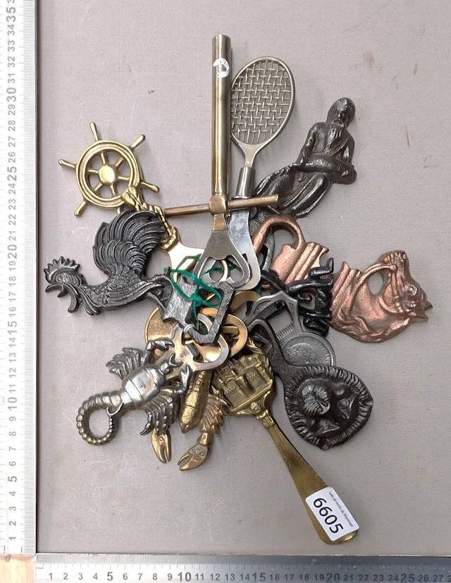 13 antique bottle openers—see photos for dimensions and condition