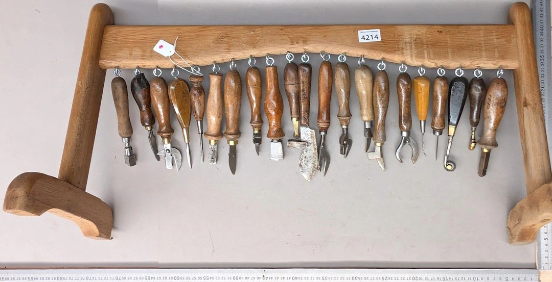 15 shoemaker's and saddler's tools on an oak base—see photos for dimensions