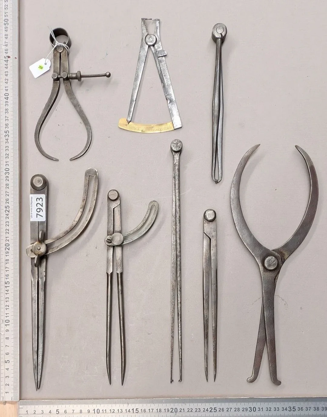 1 set of 8 different compasses—see photos for dimensions and condition
