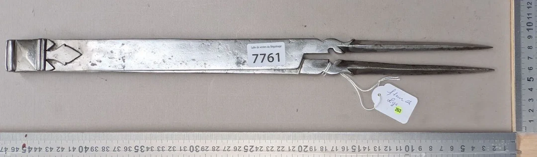 Antique 18th-century wrought-iron compass with fleur-de-lis on both