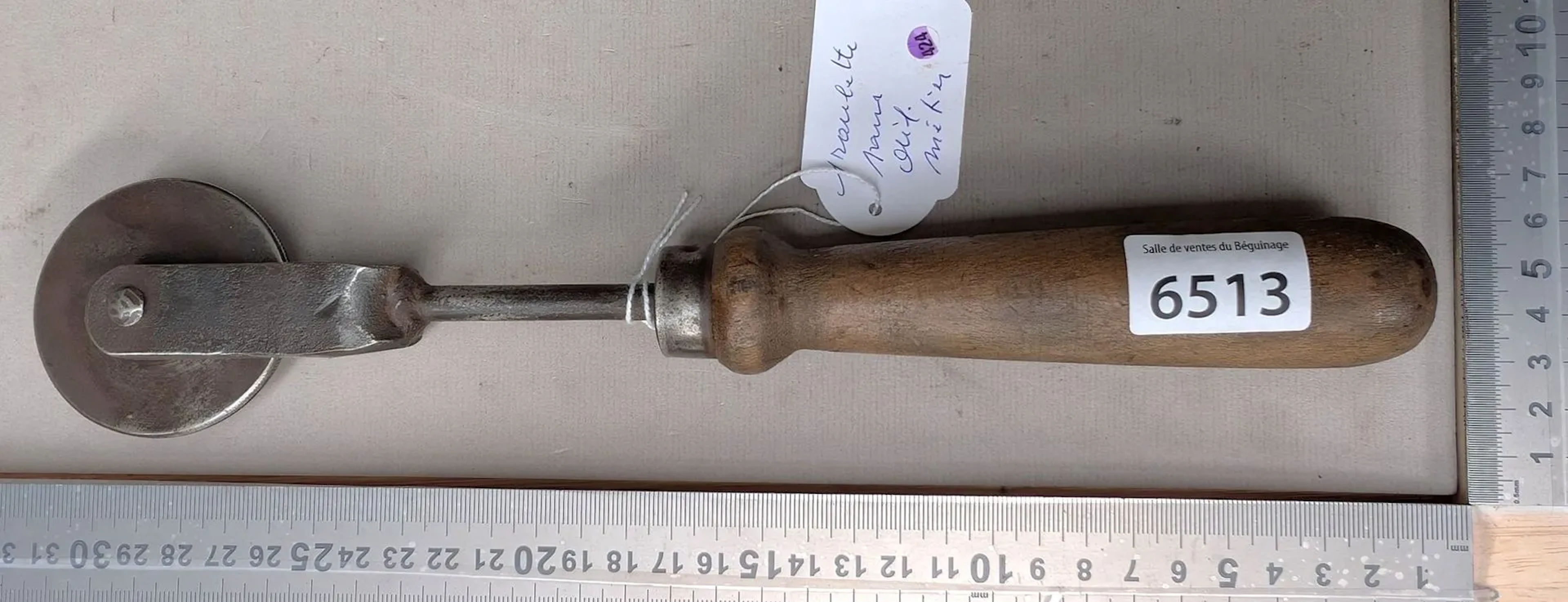 1 antique steel castor for various trades—see photos for dimensions