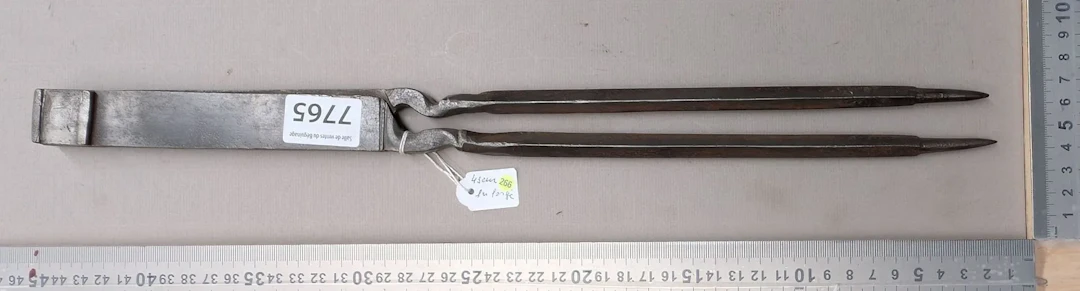 Antique wrought-iron compass with a coat of arms on both sides, 18th