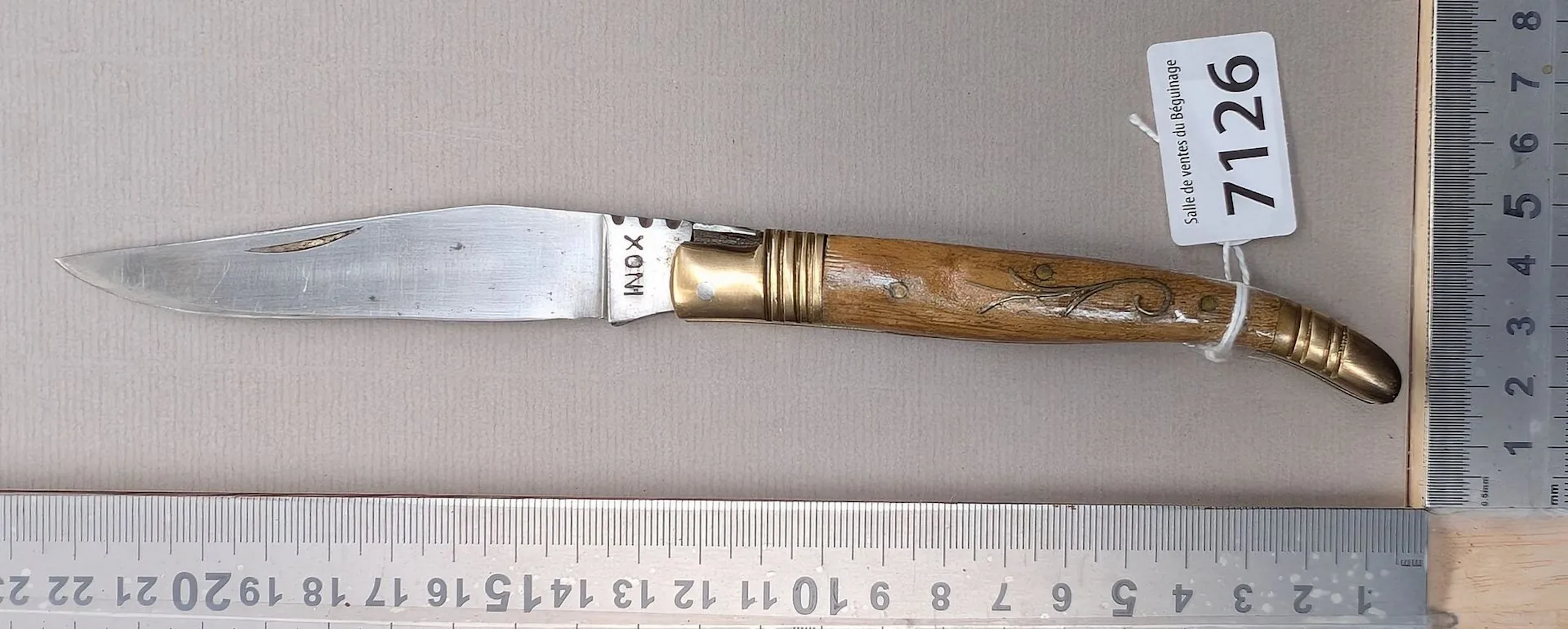 Vintage stainless steel knife with a horn handle—see photos for dimensions