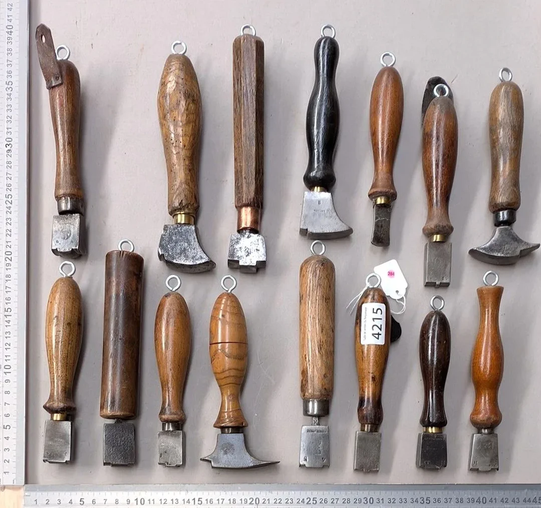 15 shoemaker's and saddler's tools on an oak base—see photos for dimensions
