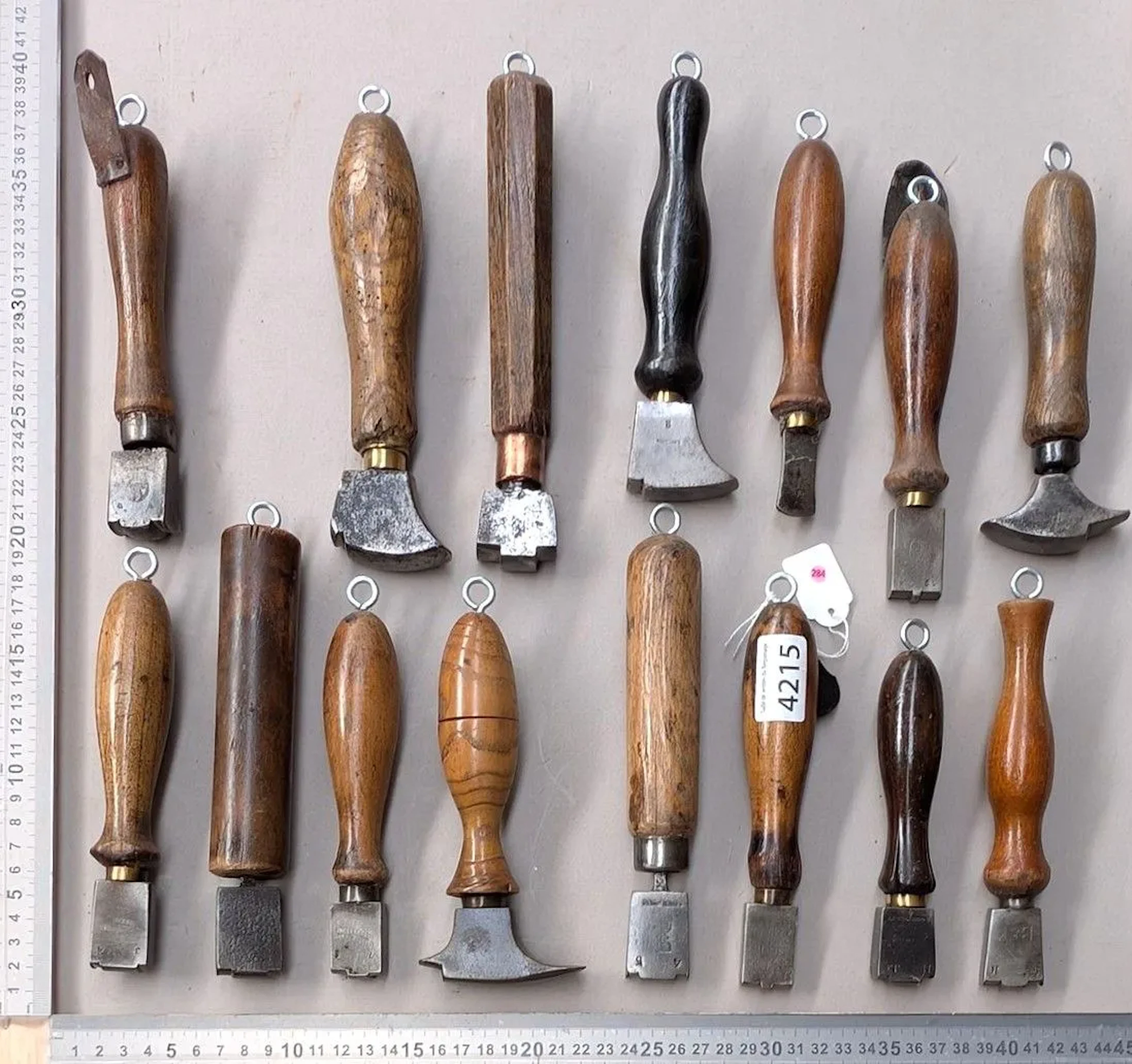 15 shoemaker's and saddler's tools on an oak base—see photos for dimensions