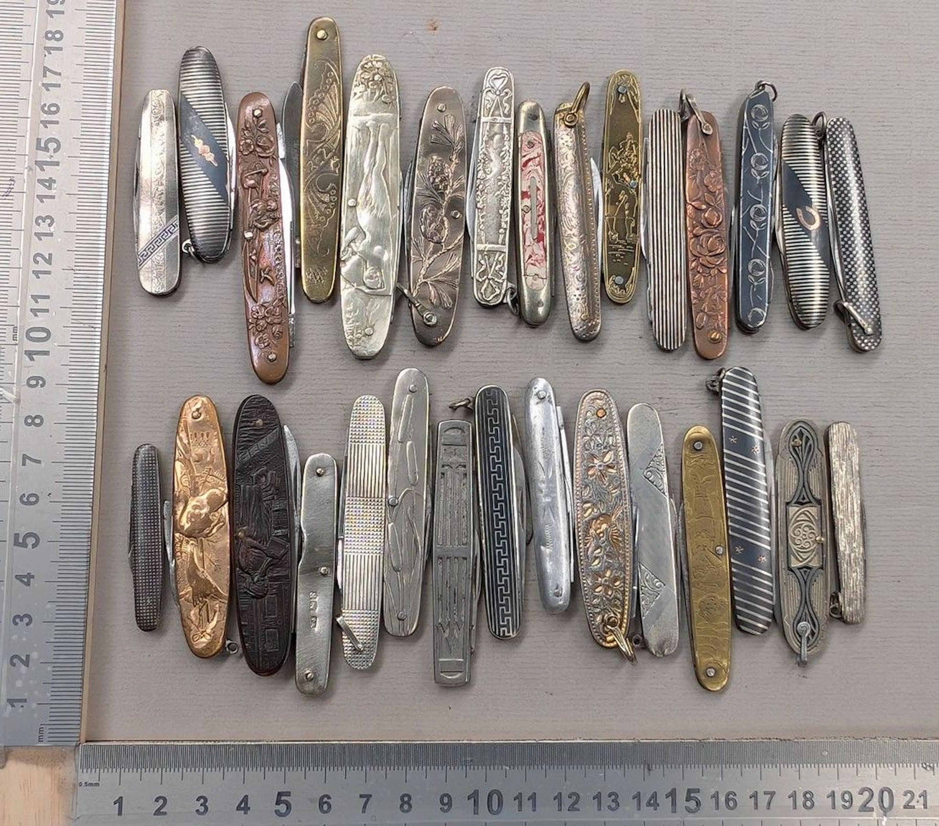 Set of 30 small antique knives with embossed decoration, 1890–1900