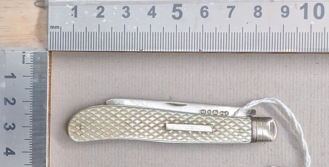 1 antique fruit knife with a silver blade and mother-of-pearl handle—see
