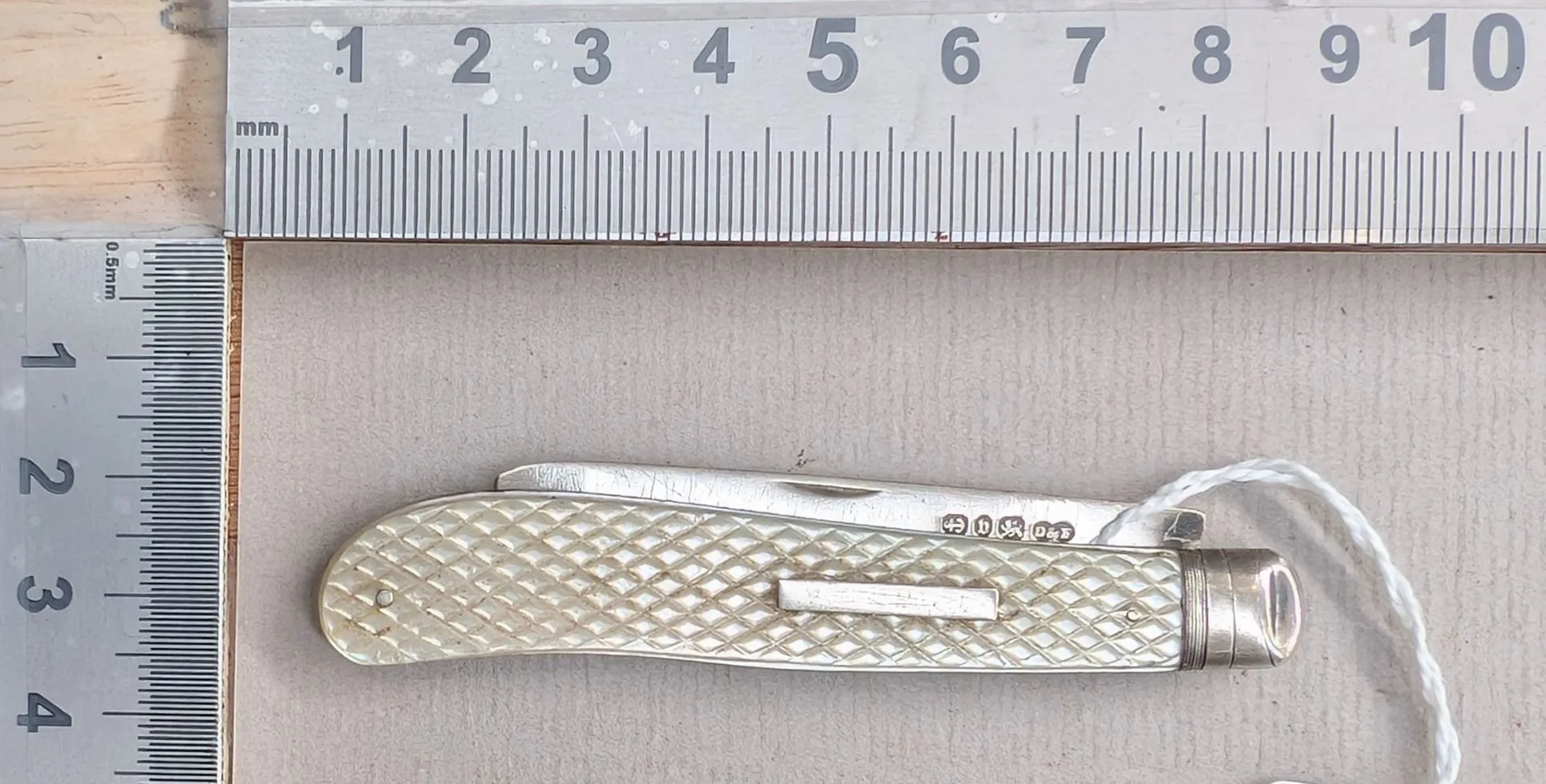 1 antique fruit knife with a silver blade and mother-of-pearl handle—see