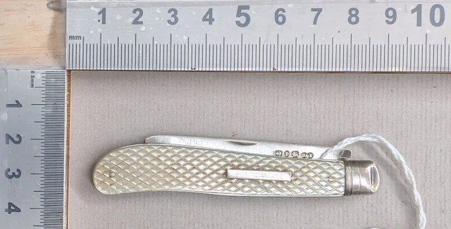 1 antique fruit knife with a silver blade and mother-of-pearl handle—see