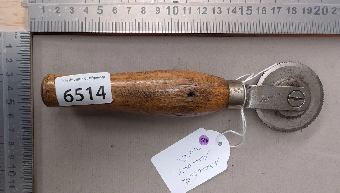 1 antique steel castor for various trades—see photos for dimensions
