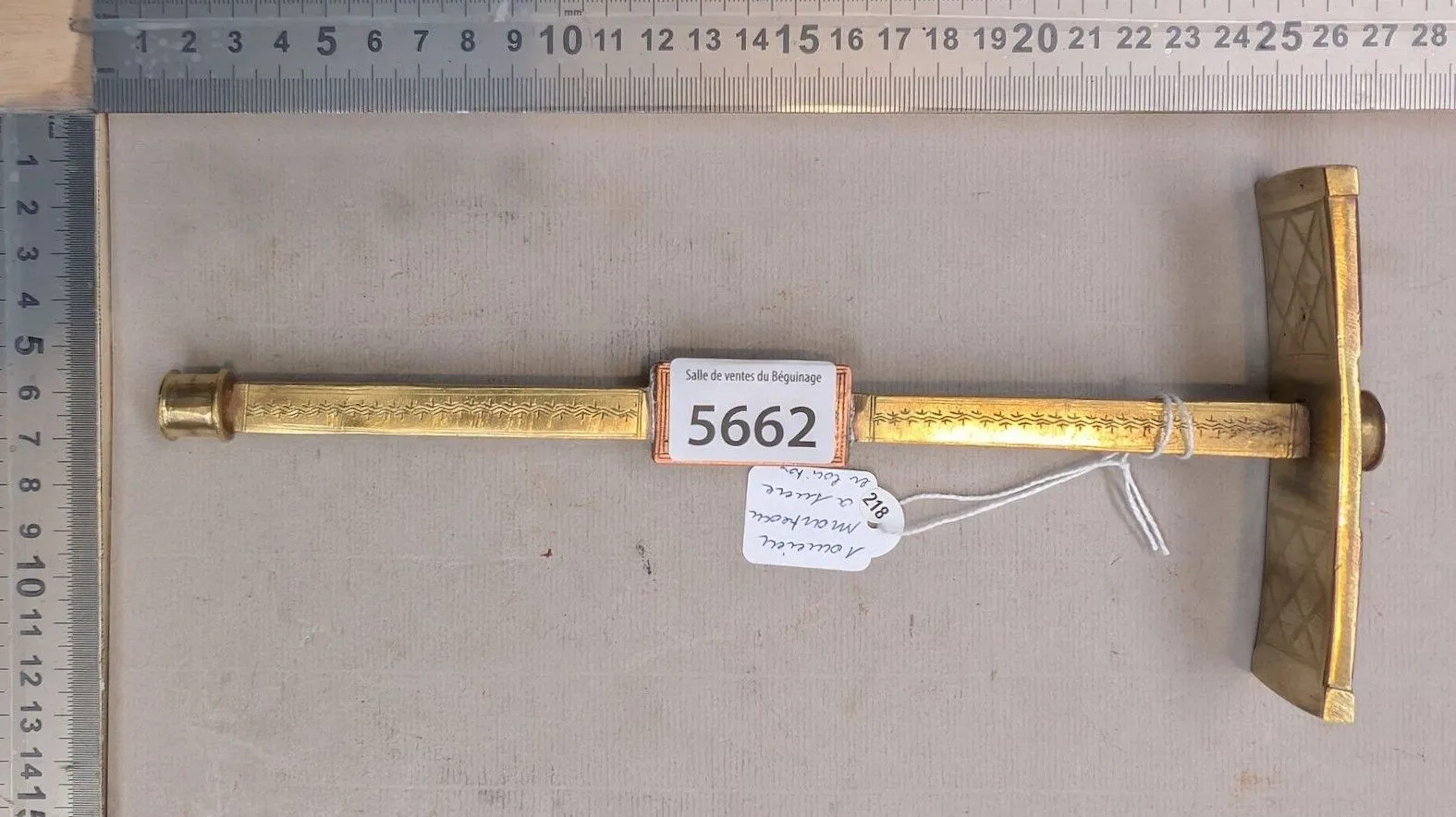 An antique brass sugar hammer—see photos for dimensions and condition