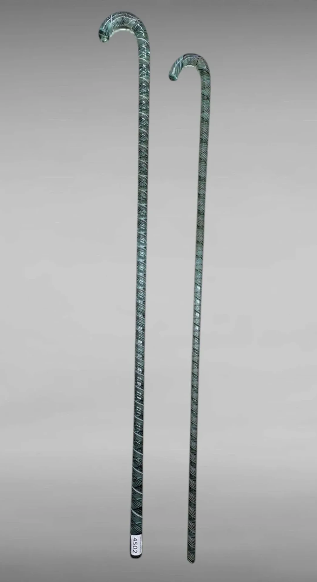 2 glass conscript canes—see photos for dimensions and condition