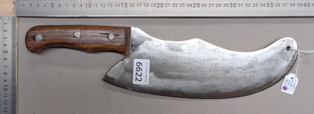 Antique cleaver with steel blade and wooden handle—see photos for