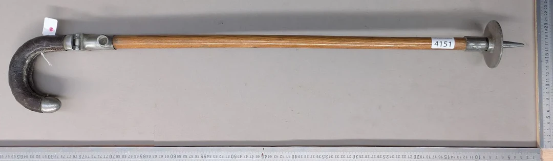 1 antique hunter's walking stick that can be used as a seat—see photos
