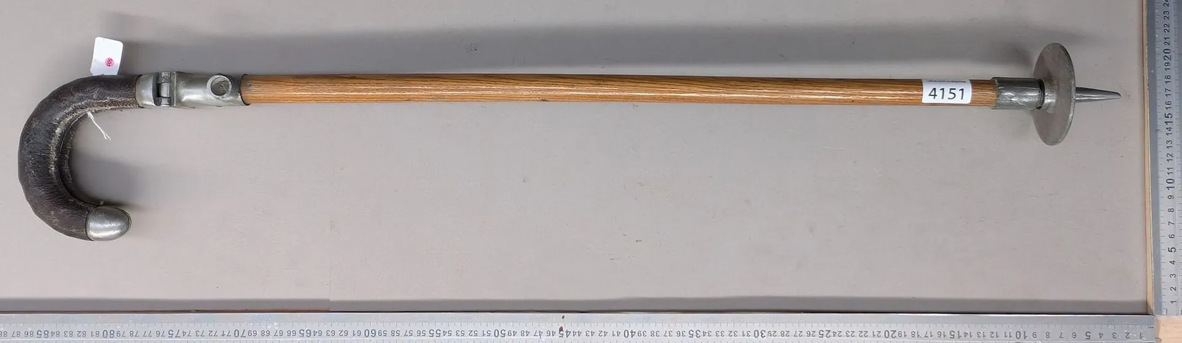 1 antique hunter's walking stick that can be used as a seat—see photos