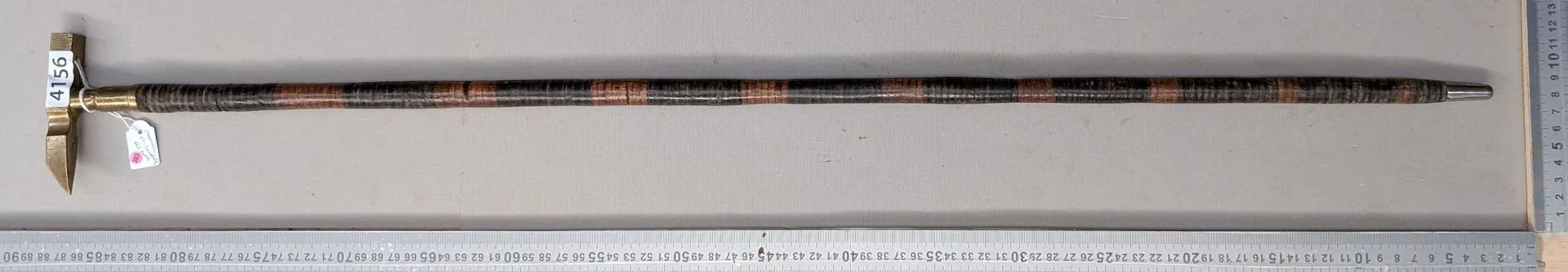 Geologist's walking stick with a leather disc handle—see photos for
