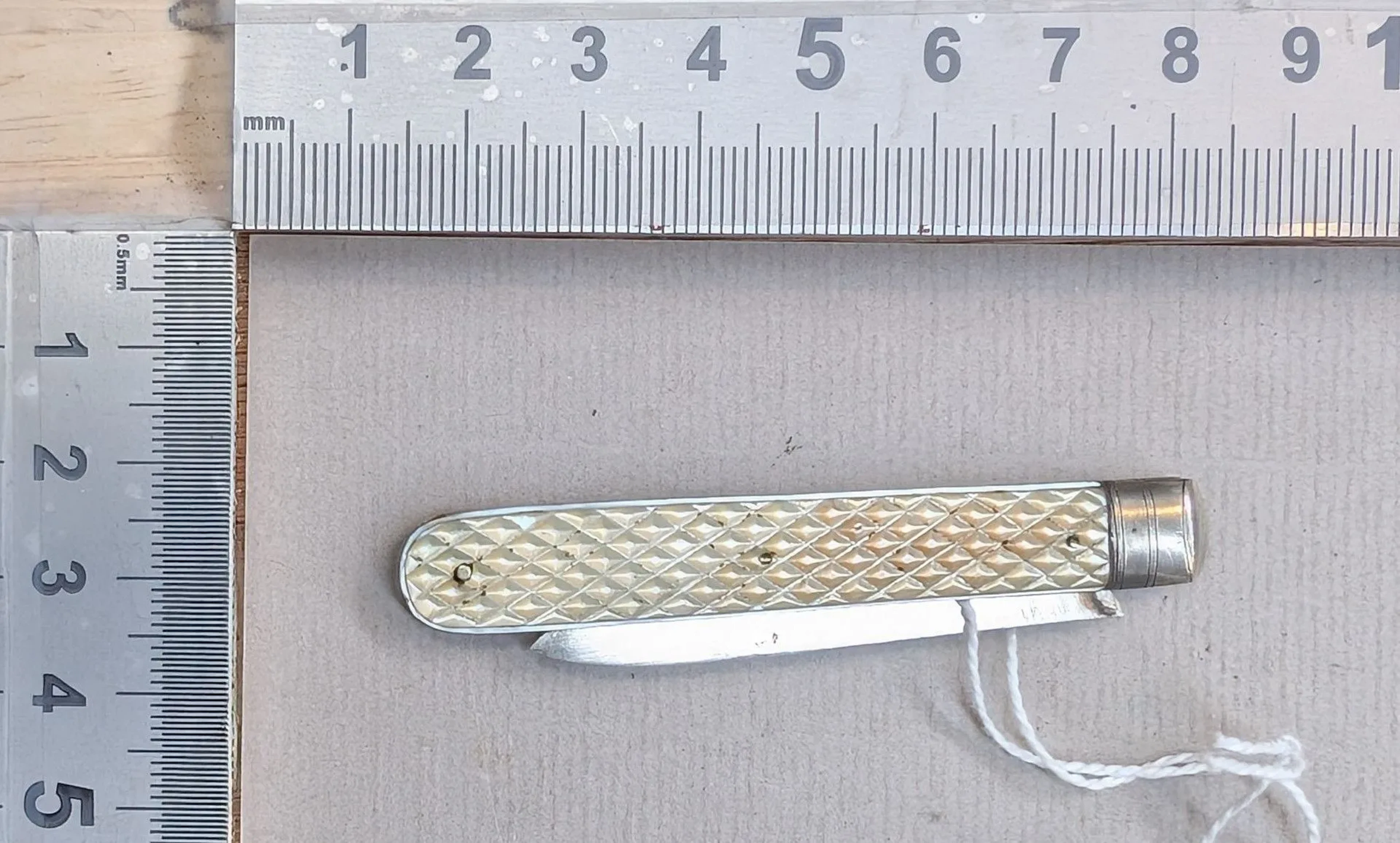 1 antique fruit knife with a silver blade and mother-of-pearl handle—see