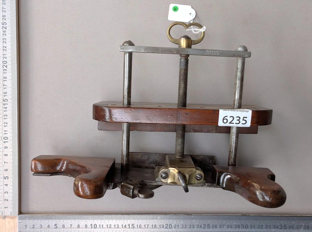 Very nice plane, made of wood, brass, and steel, without a blade—see