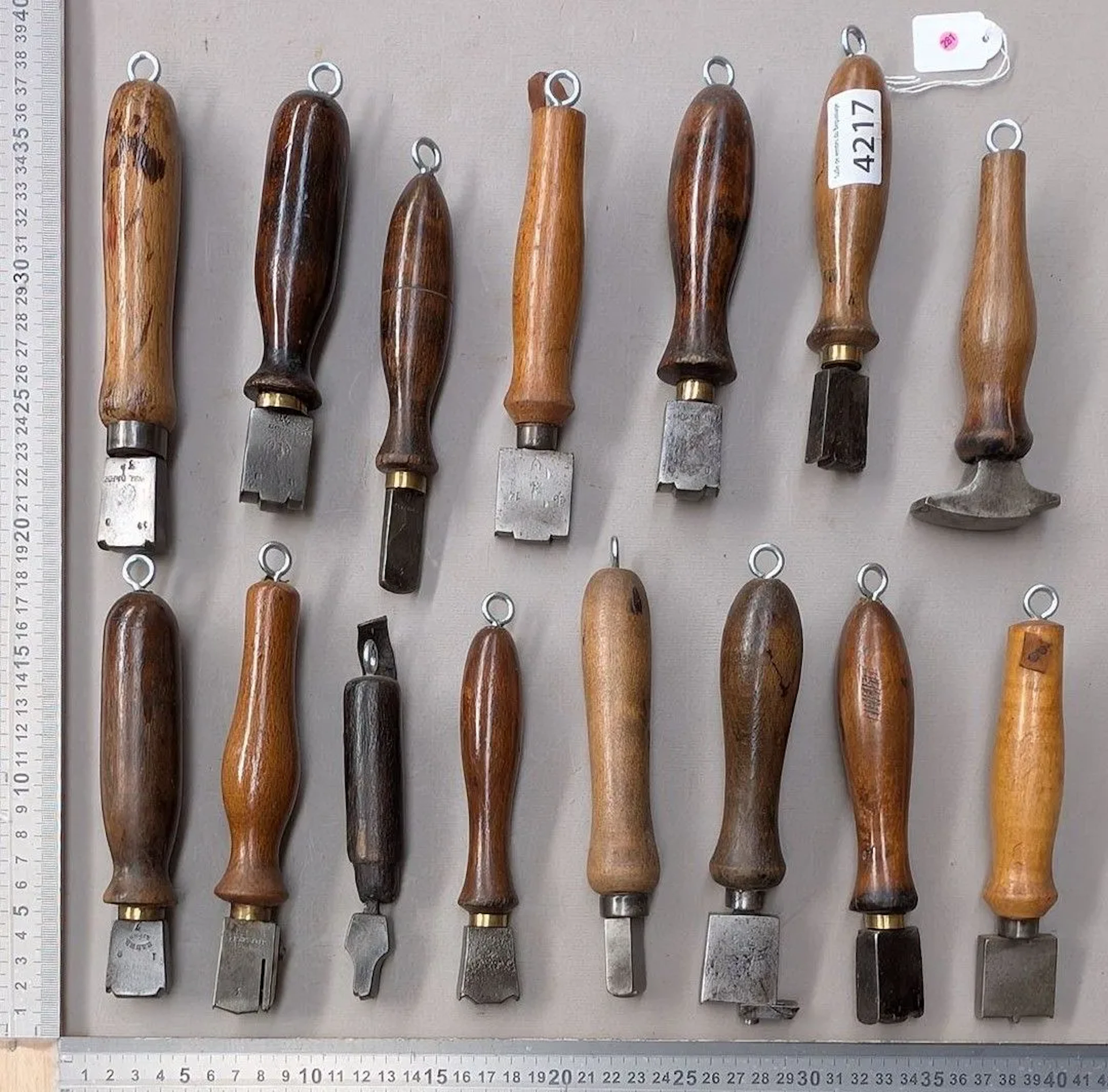 15 shoemaker's and saddler's tools on an oak base—see photos for dimensions