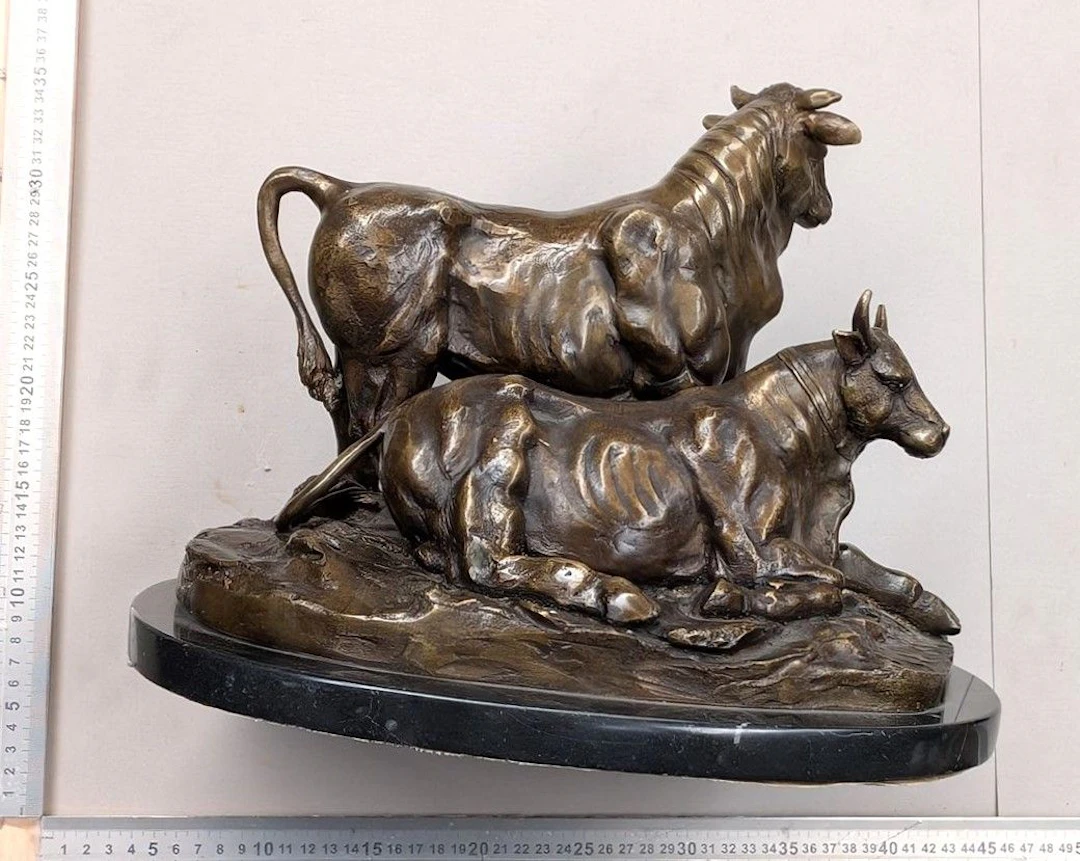 A bronze bull sculpture—see photos for dimensions and condition