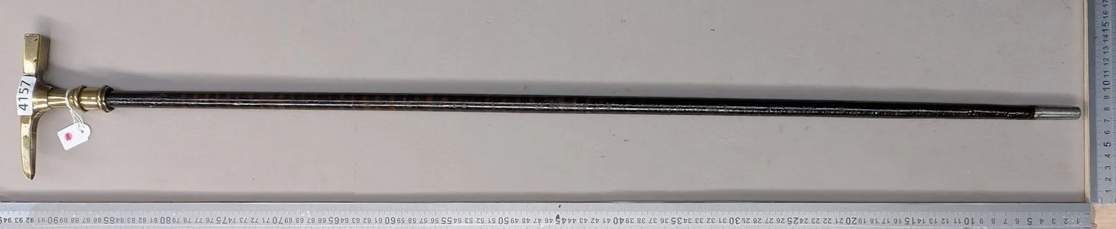Geologist's walking stick with a leather disc handle—see photos for