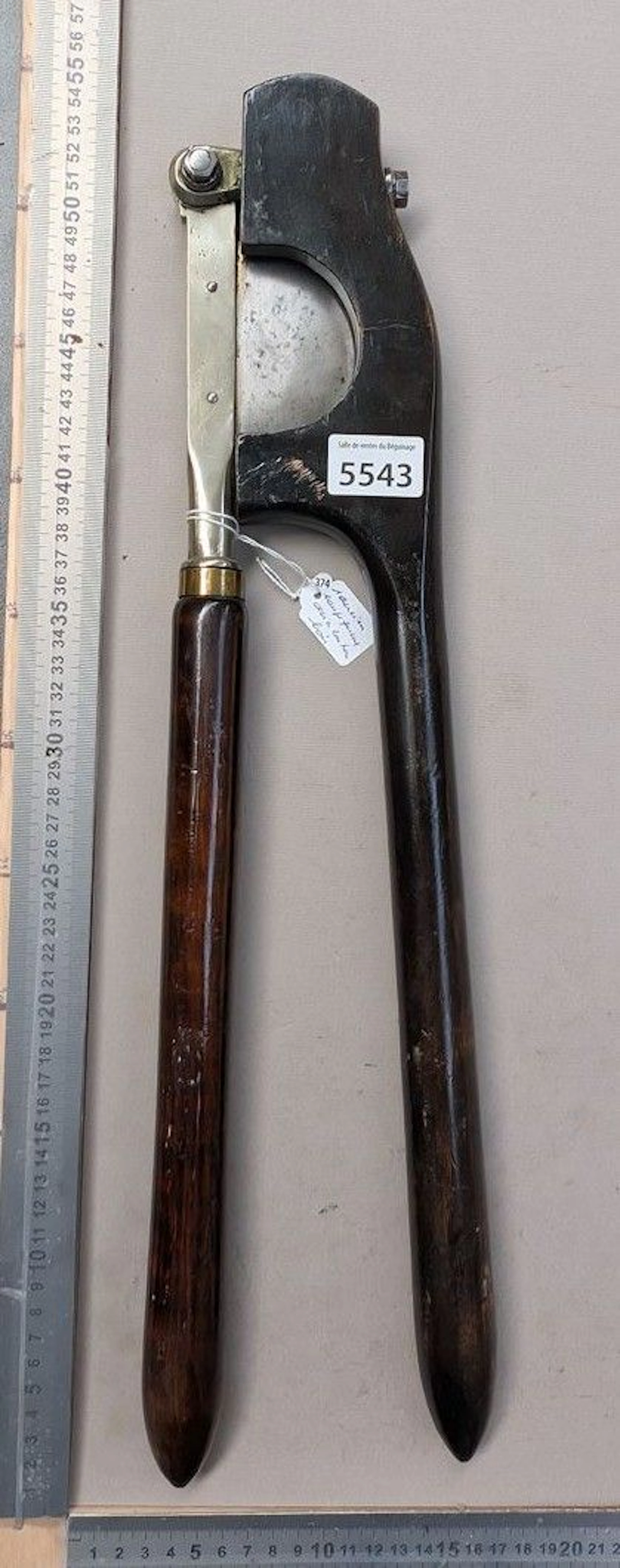 An antique tail clipper made of steel, brass, and wood—see photos