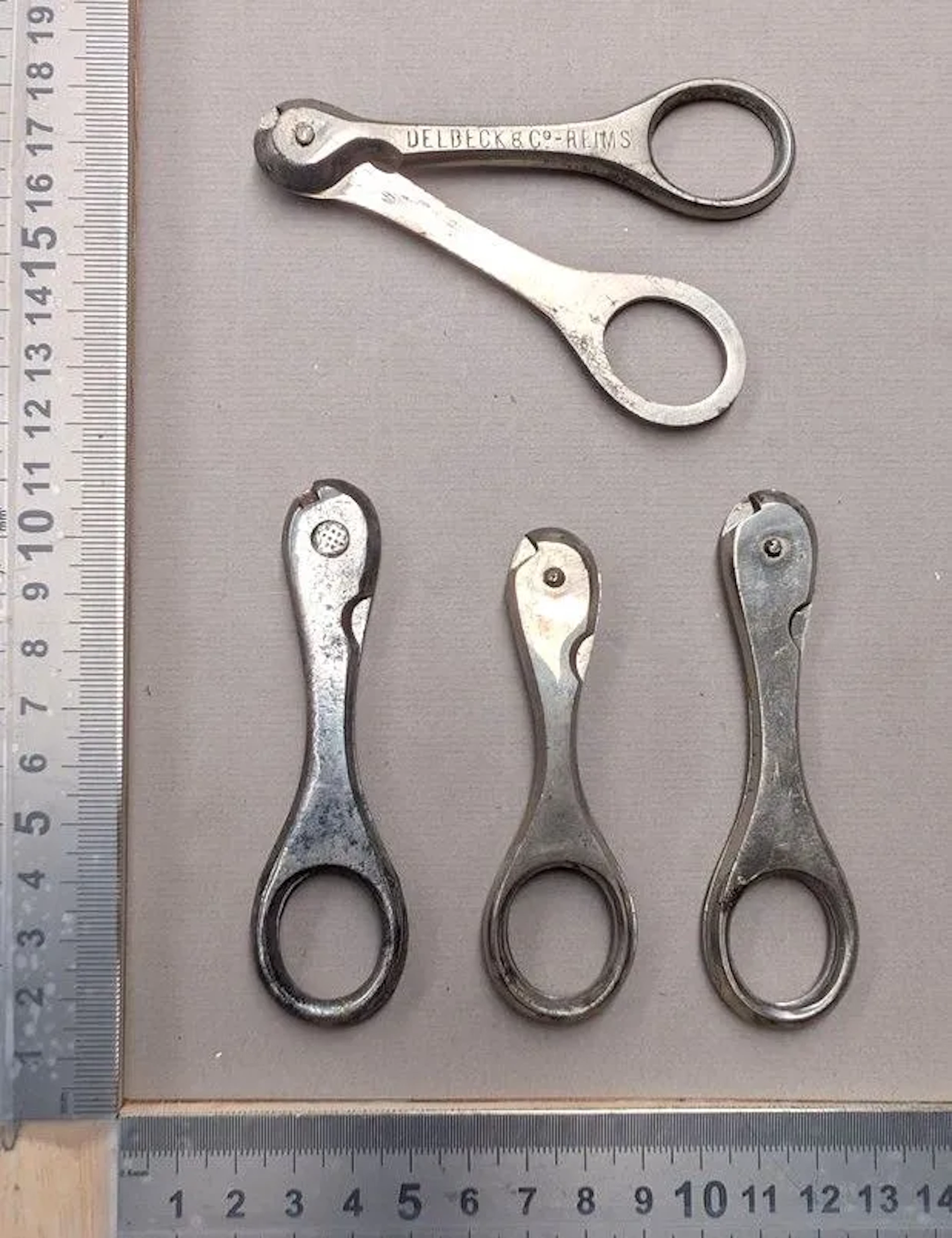 4 vintage wire-cage bottle openers—see photos for dimensions and condition