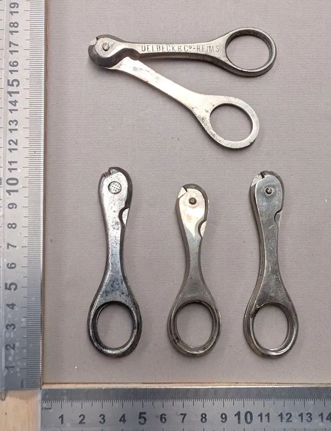 4 vintage wire-cage bottle openers—see photos for dimensions and condition