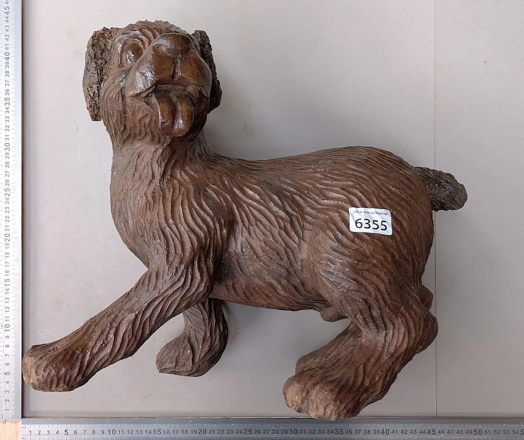 A beautiful carved wooden dog—see photos for dimensions and condition