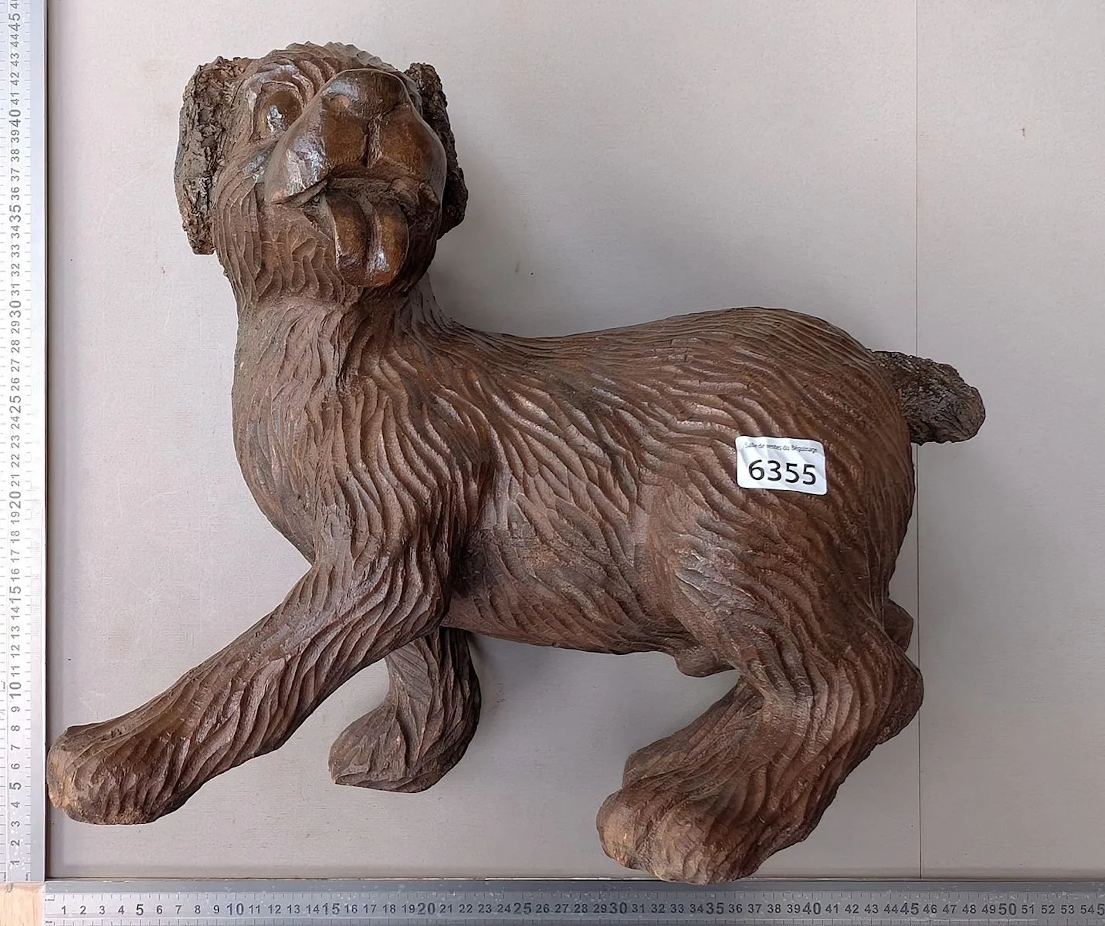 A beautiful carved wooden dog—see photos for dimensions and condition