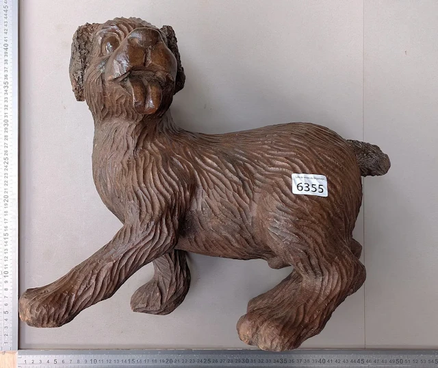 A beautiful carved wooden dog—see photos for dimensions and condition