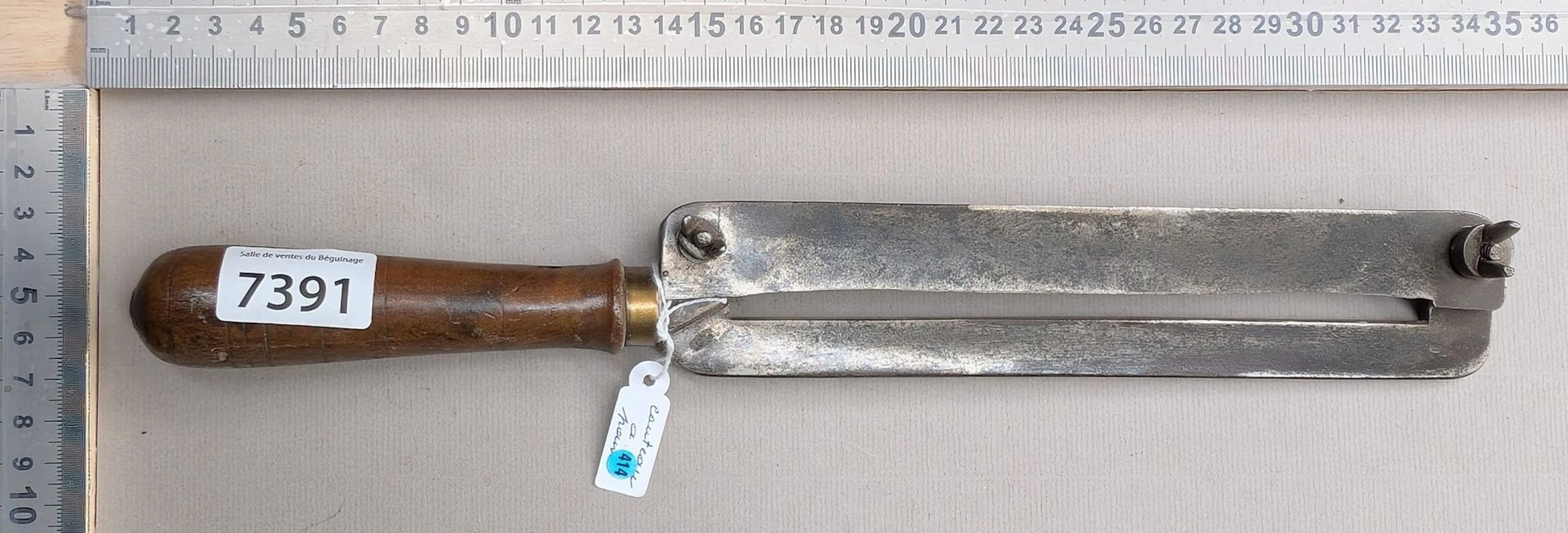 1 antique bread knife with a wooden handle—see photos for dimensions