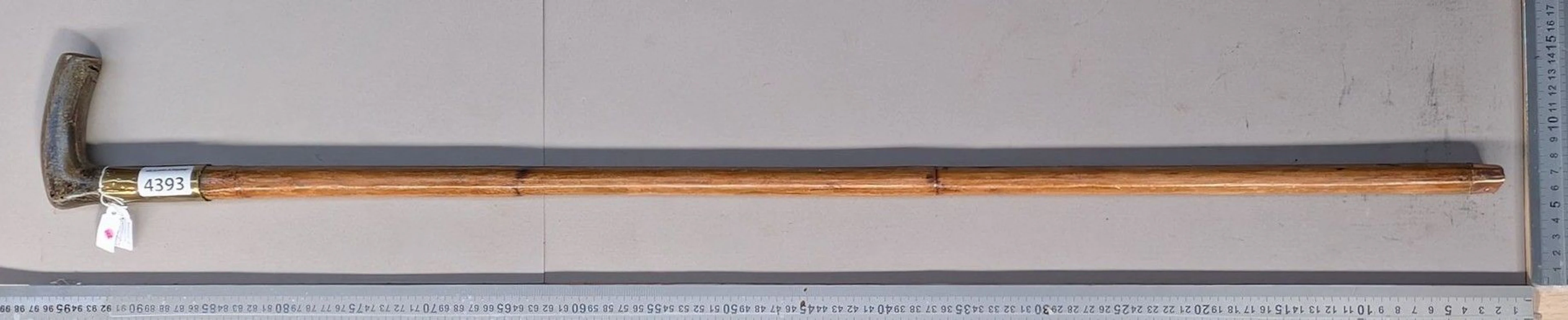 A horse dealer's stick repurposed as a measuring rod, showing signs