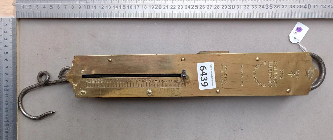 Vintage scale with a sliding needle that moves up and down—see photos