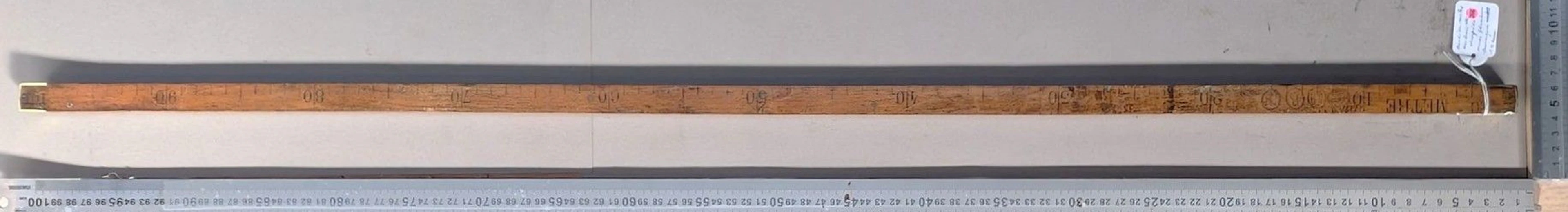 Antique wooden and brass measuring tape—see photos for dimensions and condition