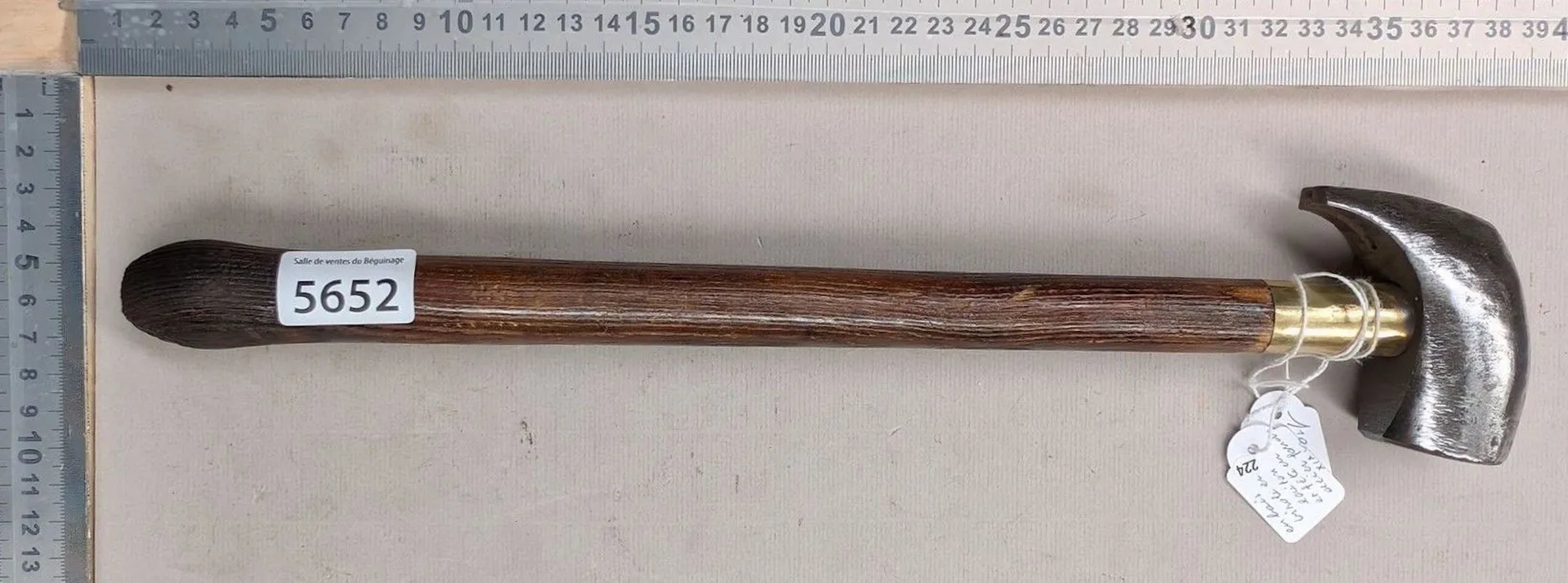 A brooch-making hammer with a wooden handle, stamped "PEUGEOT FRERES"—see