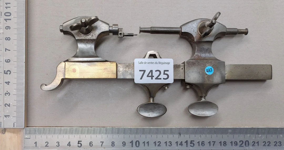 1 set of antique steel and bronze watchmaker's swivel heads—see photos