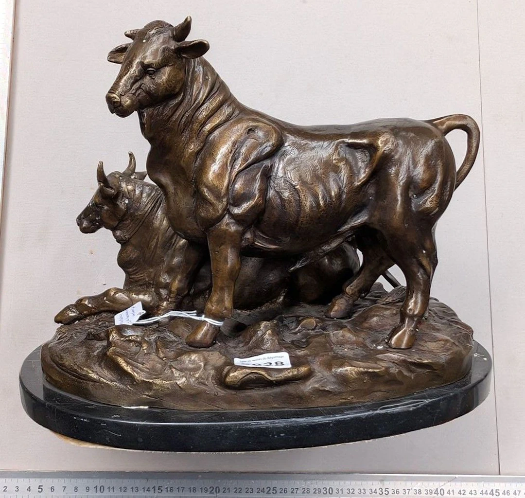 A bronze bull sculpture—see photos for dimensions and condition