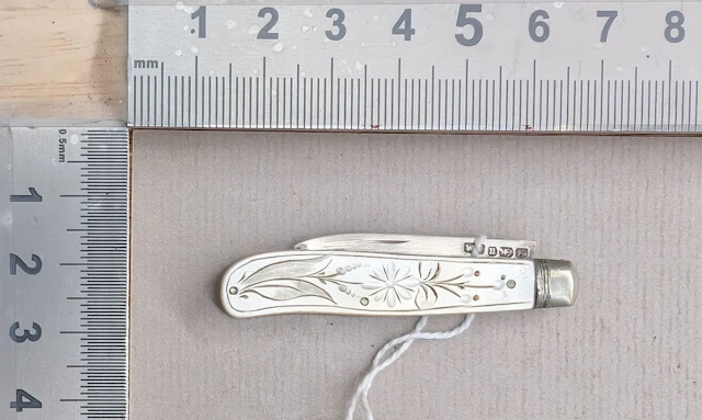 1 antique fruit knife with a silver blade and mother-of-pearl handle—see