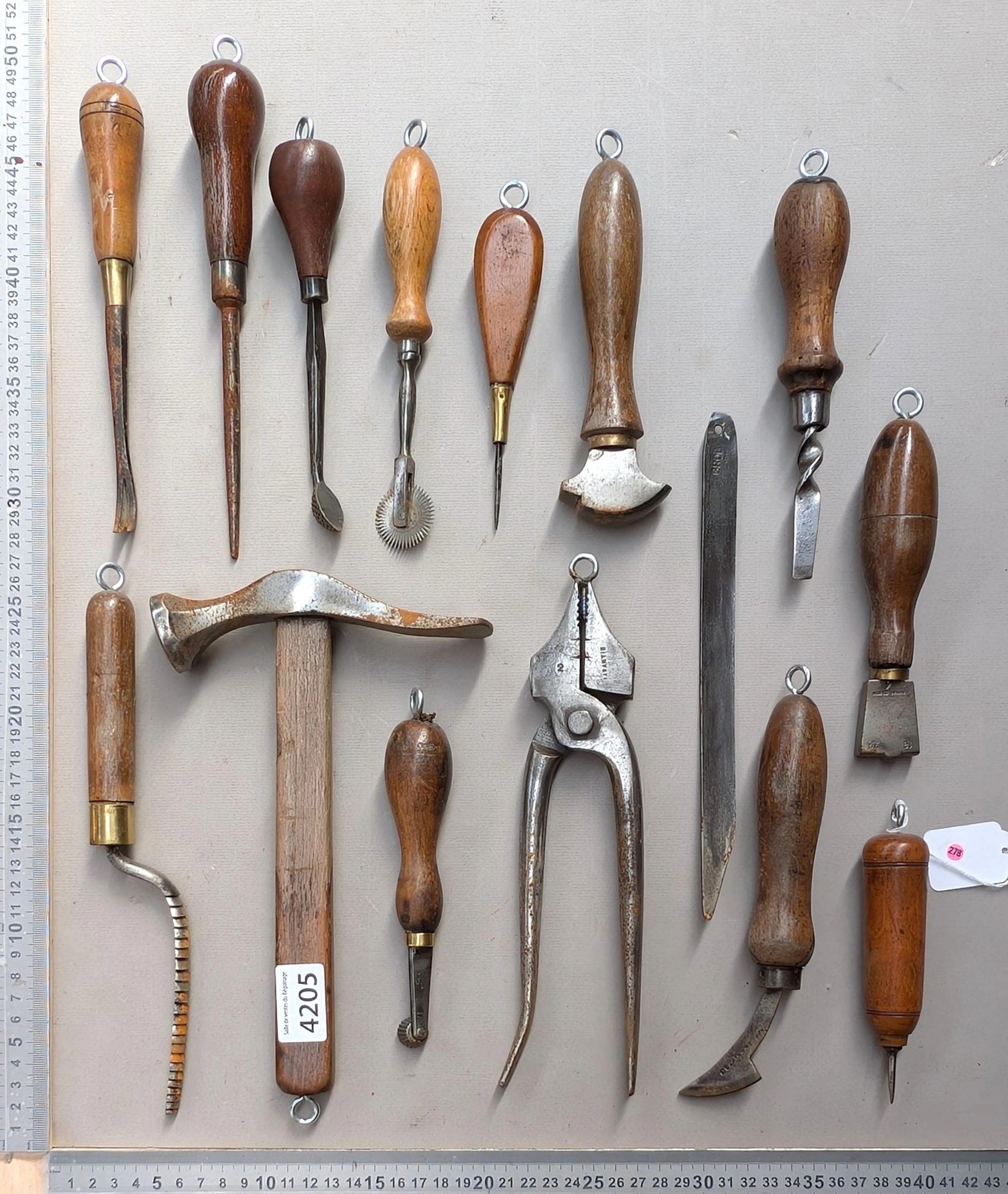 15 shoemaker's and saddler's tools on an oak base—see photos for dimensions