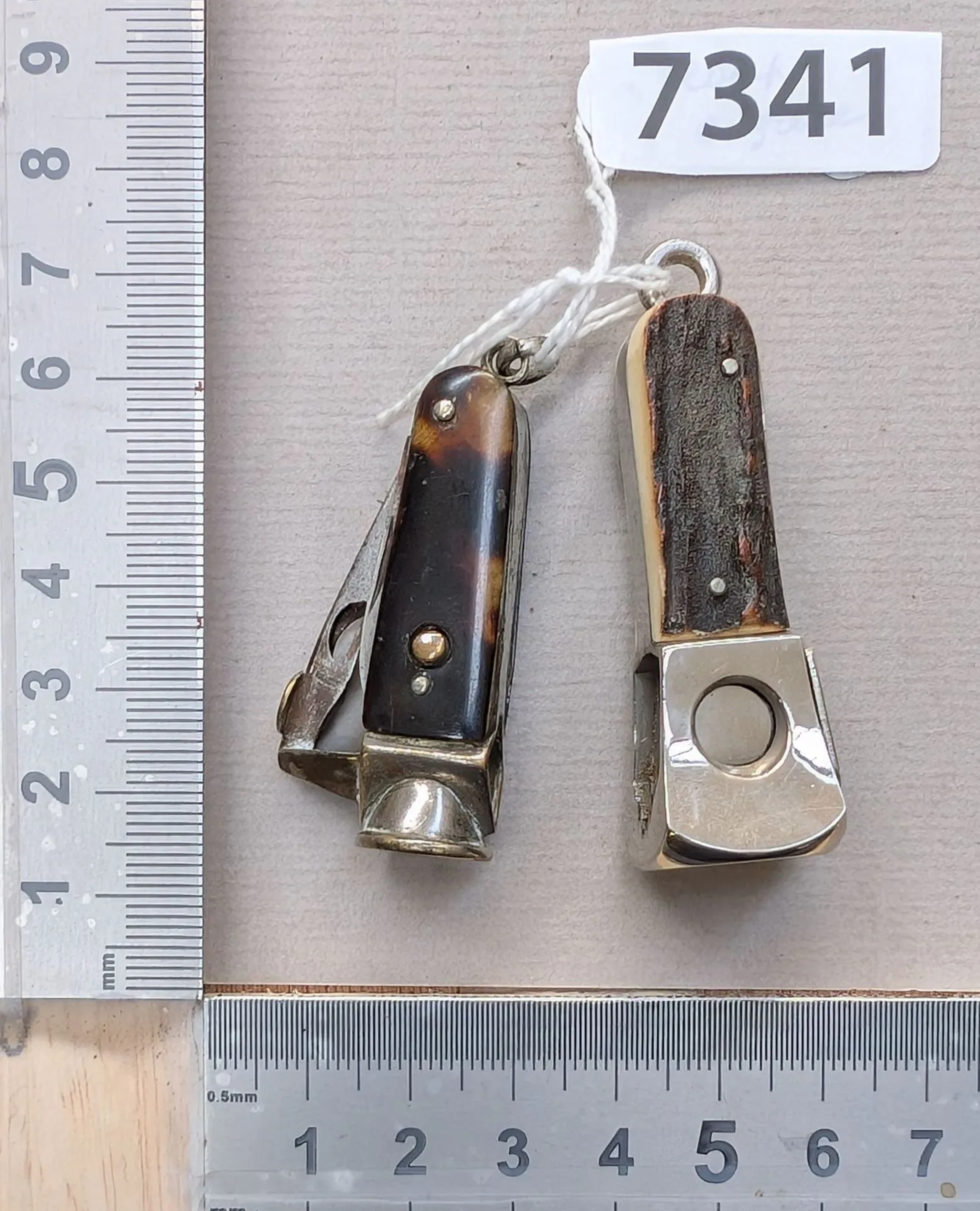 2 antique cigar cutters made of tortoiseshell and horn—see photos