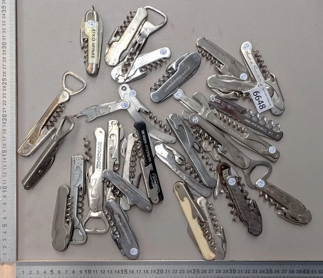 32 different bottle openers—see photos for dimensions and condition