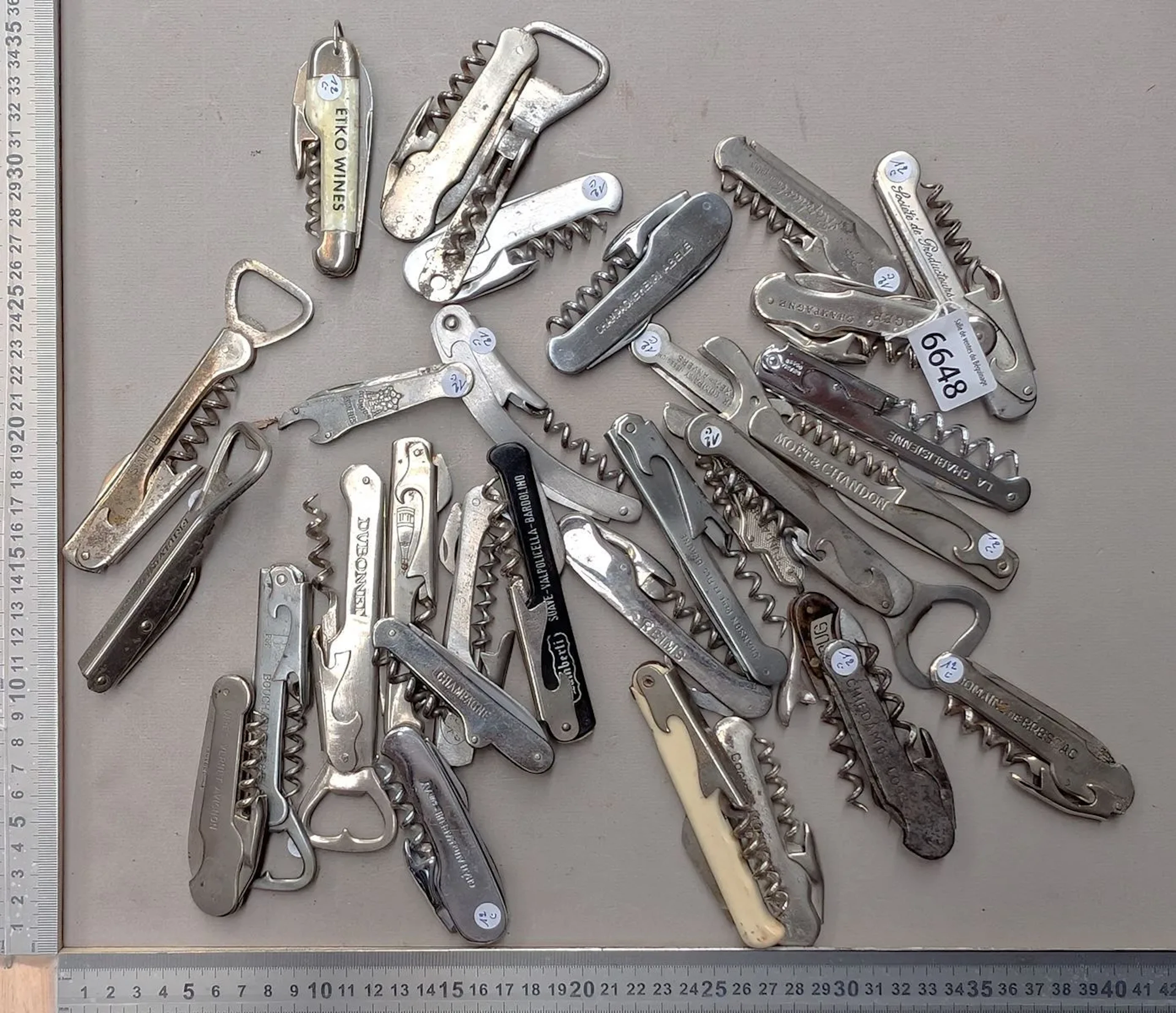 32 different bottle openers—see photos for dimensions and condition