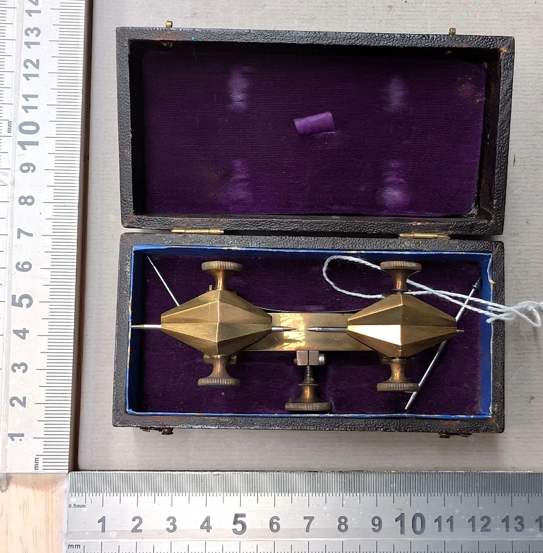 1 bronze watchmaker's compass in its case—see photos for dimensions