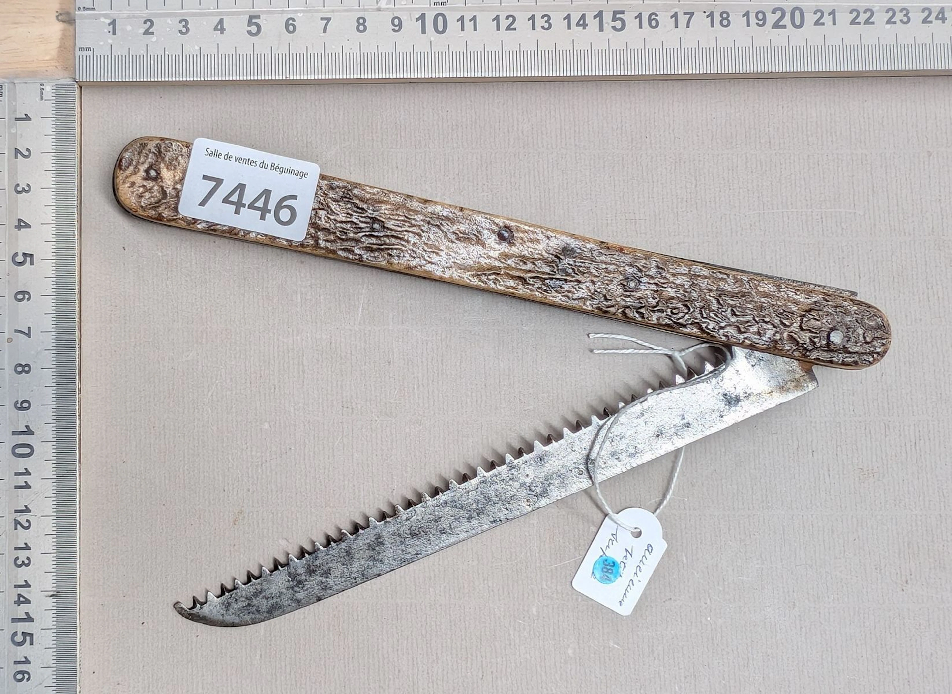 1 small vintage CALET AREIMS folding saw with a horn handle—see photos