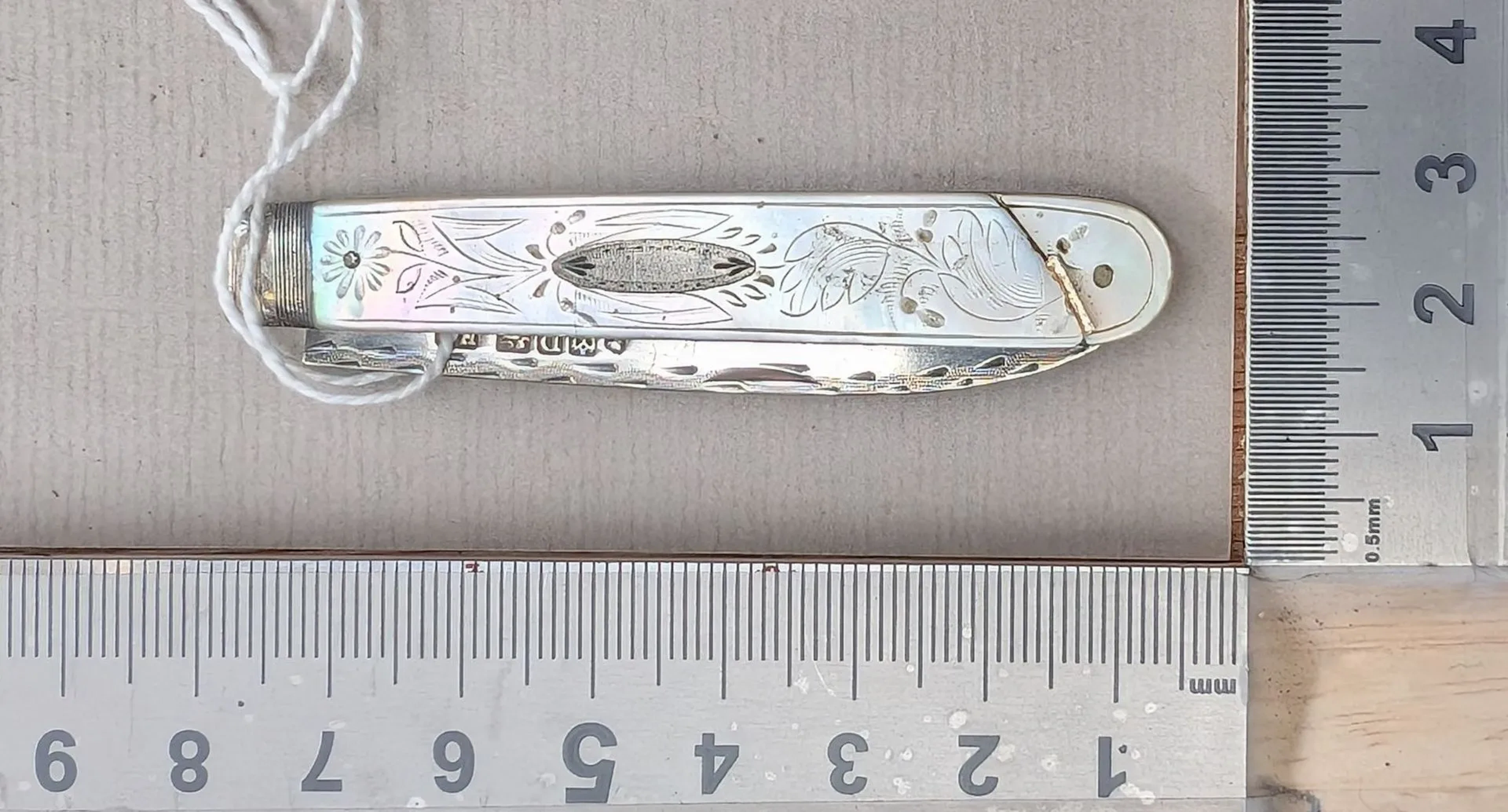 1 antique fruit knife with a silver blade and mother-of-pearl handle—see