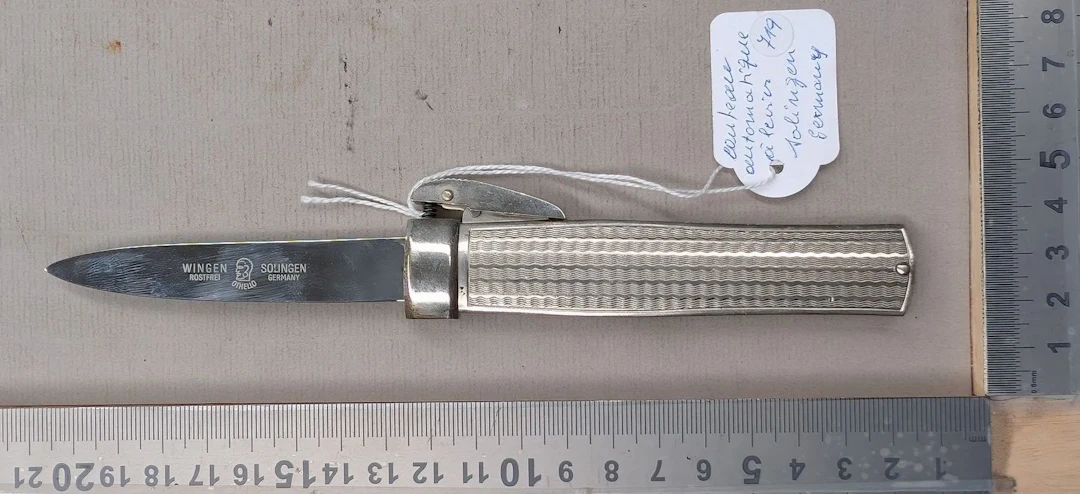 An antique SOLINGEN GERMANY lever-action folding knife—see photos